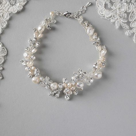 A gorgeous design of hand-wired ivory freshwater pearls, crystal beads, rhinestone accents, and marquise stones! A bracelet perfect for the beach bride or the bride looking for that handmade wedding day element! . #wedding #bracelet #handmade #bridal #cassandralynnebridal #beachwedding #weddingaccessories #bridalaccessories #isaidyes #wesaidyes #gettingmarried #pearlbracelet Hippie Bracelets, Beach Bride, Adjustable Jewelry, Swarovski Crystal Beads, Wedding Jewelry Bracelets, Bridal Bracelet, Beads Handmade, Wedding Jewelry Sets, Handmade Wedding