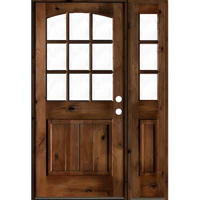 Create a bright and inviting atmosphere in your home with the rustic Knotty Alder 9 Lite V-Groove Panel Prehung Exterior Door from Krosswood Doors. This timeless arch top door features natural wood grain, unique knotting, a sidelite, and nine glass panels to allow plenty of natural light into your home. Our wood doors are crafted with superior construction and hand finished to ensure that each one is a true work of art. Find your perfect fit today with our customizable sizes, layouts, and stain Knotty Alder Door, Prehung Exterior Door, Provincial Stain, Stain Wood, Fake Wood, Knotty Alder, V Groove, Alder Wood, Unique Doors