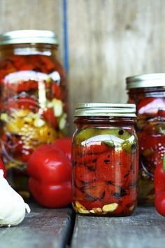 Fire Roasted Red Peppers Preserved in Olive Oil: delectable fire roasted peppers to add to everything from pizza to pasta to salad to pimiento cheese to sandwiches through the cold months.roasted red pepper, smoked bleu cheese and garlic stuffed kalamata pizzas, or roasted red pepper pasta, or grilled chicken and roasted bell pepper sandwiches.   Store in the refrigerator for up to three months or in the freezer for up to a year. Fire Roasted Red Peppers, Canning Food Preservation, Olive Oil Recipes, Garlic Olive Oil, Garden Recipes, Roasted Peppers, Fire Roasted, Peppers Recipes, Roasted Red Peppers