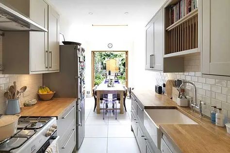 Clapham's 90 inch-wide narrow house transformed into a luxury family home | Homes and Property | Evening Standard Long Narrow Kitchen Layout, Small House Kitchen Design, Narrow Kitchen Layout, Narrow Dining Tables, Long Narrow Kitchen, Narrow Kitchen Island, Galley Kitchen Layout, Light Wood Kitchens, Kitchen Remodel Cost