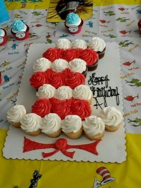 Cat n the hat cupcake cake Cat In The Hat Cupcake Cake, Dr Seuss Cupcake Cake, Dr Suess Cupcake Ideas, Cat In The Hat Treats, Cat In The Hat Cupcakes, Cat In The Hat Cake Ideas, Dr Suess Cake Ideas, Cat In The Hat Birthday Party Ideas, Dr Suess Birthday Cakes