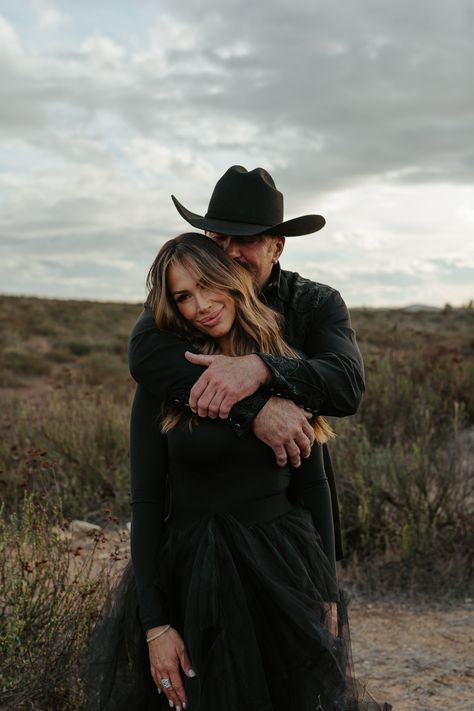 Moody engagement photos with cowboy hat and red bottoms Moody Romantic Photoshoot, Western Engagement Photos Outfits, Couple Western Photoshoot Ideas, Edgy Engagement Photos, Cowboy Couple Photoshoot, All Black Engagement Photos, Couples Photoshoot Western, Moody Couples Photoshoot, Cowboy Engagement Photos