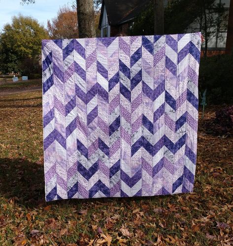 My first quilt! It's made using half-square triangles in a herring bone pattern of light and dark purple. It's quilted along the vertical seams at 1/4" on each side. Purple Quilt Patterns, Gradient Quilt Ideas, Herringbone Quilt Pattern, Purple Quilts Ideas Color Combos, Purple Quilt, Purple Quilts Ideas, Purple Quilts Ideas Free Pattern, Blue And Purple Quilts, Purple And Grey Quilts