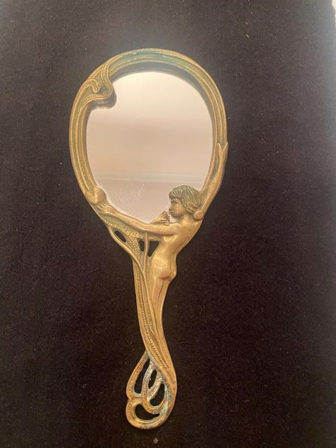 Vintage Art Nouveau brass hand mirror has a beautiful patina from age.  It can be polished and shined up but the patina takes years to accumulate.  It measures 9 & 1/2" by 4 & 1/4". The back of the mirror is a piece of felt which makes it easy to put on a new back that is individualized & creative. The range of possibilities for a new back is limitless.  Price:  $86.00 Shipping: $11.40 No returns ! Hand Mirror Drawing, Mirror Drawing, Mirror Drawings, Props Design, Brass Hand, Brass Art, Forest Hills, Prop Design, Hand Mirror