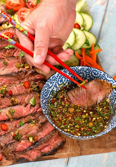 Using chopsticks to dip a piece of steak into the dipping sauce. Crying Tiger Beef Recipe, Tiger Cry Beef Recipe, Asian Potluck Dishes, Crying Tiger Sauce, Crying Tiger Steak, Crying Tiger Beef, Thai Steak, Authentic Thai Recipes, Thai Recipes Authentic