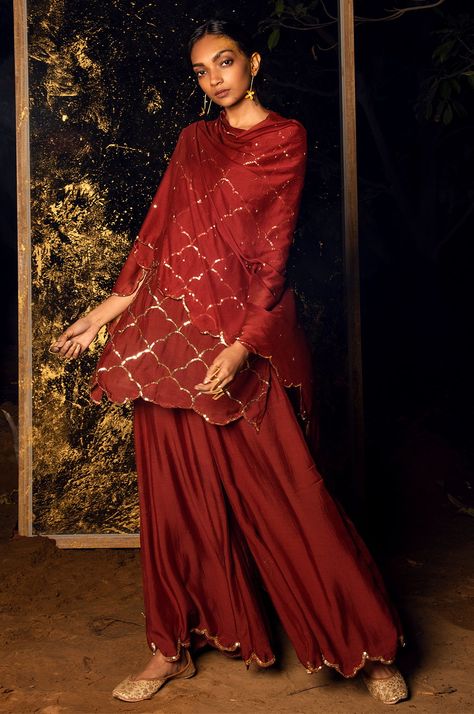 A perfect blend of traditional and modern style can be showcased through our set. While the dark color and extensive work add to the overall richness, the modern cut makes it suitable for a contemporary woman.  #eidoutfit #shortkurtawithpalazzo #sequinworksuit #trendingethnicwear #indianwear #modestfashion #eid2019 Short Kurta Outfit, Mughal Jaal, Work On Dupatta, Kurta With Palazzo, Eid Outfit, Short Kurta, Palazzo Set, Silk Kurta, Embellished Jacket