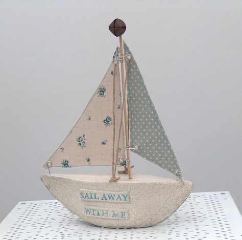 A handmade boat, with ceramic base, built by me! The clay is finished in a lovely matt finish crackle glaze, to give the whole thing a weathered look. The words ' Sail Away With Me' are printed into the clay on both sides of the boat. the sails are made in a lovely vintage type fabric, backed with a beige linen cotton. Gorgeous greens and blues are used to add to the nautical theme. Don't forget the lovely rusty bell on the top! A stunning piece, which will enhance any home. The boat measures 21cm at it's widest point, and 25cm high. Wooden Boat Building, Build Your Own Boat, Wooden Boat Plans, Speed Boat, Nautical Art, Vintage Type, Crackle Glaze, Boat Plans, Ceramic Base