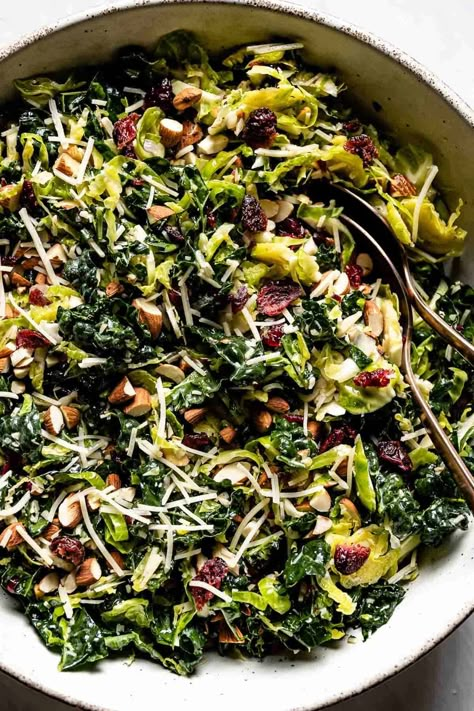 This healthy Kale Brussel Sprout Salad is loaded with toasted almonds, parmesan cheese, and a delicious tangy dressing. Throw it together for a light meal or the perfect fall side dish. Dressing For Brussel Sprout Salad, Hot Brussel Sprout Salad, Kale Fall Salad, Roasted Salad Recipes, Brussel Sprout Pasta Salad, Shredded Brussel Sprout Recipes, Autumn Salad Dressing, Warm Brussel Sprout Salad, Julias Album