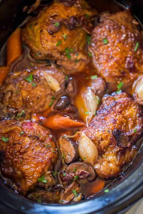 Slow Cooker Coq Au Vin has all the red wine braised chicken flavors with shallots, chicken, garlic, mushrooms and carrots in the classic French dish you love. Slow Cooker Coq Au Vin, Classic French Dishes, Crock Pot Recipes, Bbc Food, Slow Cooked Meals, French Dishes, Braised Chicken, Easy Slow Cooker Recipes, Chicken Slow Cooker Recipes