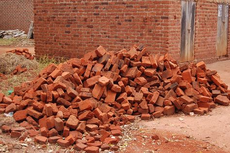 A pile of fired bricks ready for laying. Between each course will be a thick layer of mortar which is both expensive and non environmentally friendly. Bricked Up, Uni Accommodation, Sky Tutorial, Ap Drawing, Sustainable Construction, Brick Laying, Family Trees, Halloween 2022, Delft