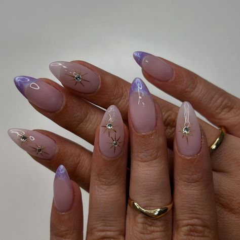 Rapunzel💜✨ • • • • #nailsxkay #nailsnailsnails #apresnails #gelx #gelxnails #prettynails #trendynails #naildesign #nailart #nailextentions #bombnails #cutenails #nailinspo #pinterestnails #trendynails #explore #explorepage #scvnails #calinails #LAnails #summernails #nailsofinstagram #starnails #purplenails #pearlnails #swirlnails #crystalnails #lavander #demure Lavender Nail Ideas Almond, Rapunzel Themed Acrylic Nails, Repunzle Themed Nails, Purple Rapunzel Nails, Stars And Moon Nails Design, Libra Season Nails, Tangled Acrylic Nails, Repunzle Nail Ideas, Rapunzel Nail Ideas