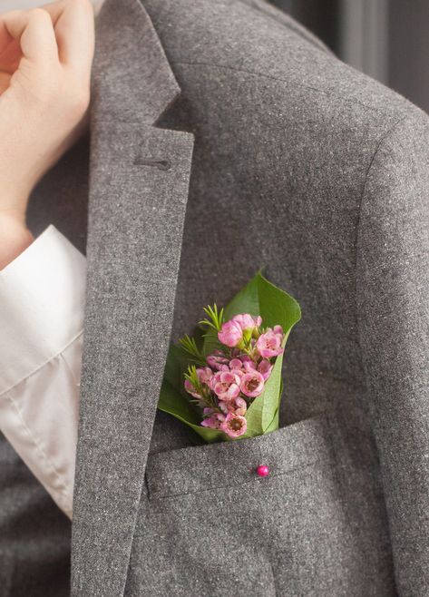 Buttonholes by PC Creations Leeds. Breaking with tradition this groom's flowers are in his pocket. Some stalwarts would say, that should never be. I would reply, 'But why not?' Buttonhole, pink wax flowers with lemon leaves. Nothing over the top. A simple, yet stunning buttonhole with that lovely subtle scent that wax flowers give off at the slightest touch. Wedding Buttonholes, Buttonhole Flowers, Button Holes Wedding, Lemon Leaves, Wax Flowers, Fresh Flower, Silk Flower, Over The Top, Plan Your Wedding