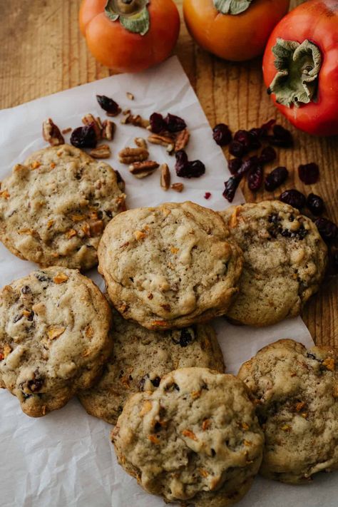 'Tis the season for cookies, and these Fresh Persimmon Cookies are among the very best. Tender, cakey, sweetly spiced and fruit-laced cookies are loaded with texture from crunchy nuts and chewy raisins or dried cranberries in this persimmon cookie recipe. Made with just 12 ingredients and 10 minutes of prep, these delicious drop cookies are always a favorite during the cooler months. Monk Fruit Cookie Recipes, Best Persimmon Cookies Recipe, Persimmon Bars, Persimmons Recipes, Persimmon Cookies Recipe, Yule Dinner, Persimmon Cookie Recipe, Pomegranate Cookie, Persimmon Cookies