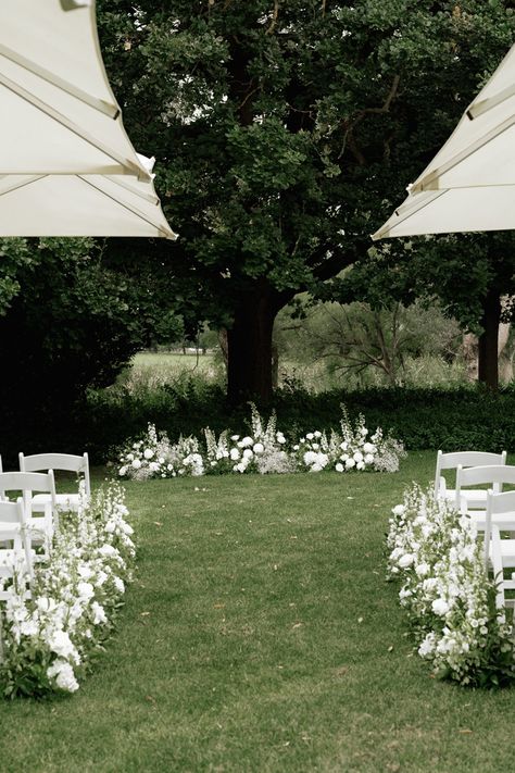 Minimalist Ceremony Backdrops, Timeless Intimate Wedding, Timeless Wedding Altar, Grounded Arch Wedding, Wedding Florals With Greenery, Minimal Wedding Aisle Decor, Wedding Alter Ideas Outside, Simple Wedding Ceremony Florals, Wedding Flowers Ceremony Altar