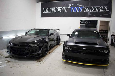 Chevrolet Camaro ZL1 1LE painted in Black w/ a Satin Black wrapped hood and a Dodge Challenger SRT Demon painted in Black w/ a Satin Black wrapped hood  Photo taken by: @rkrally.official on Instagram Blacked Out Camaro, Matte Black Camaro, Camaro Car Black, Blacked Out Camaro Zl1, Chevrolet Camaro Black, Chevrolet Camaro Zl1, Dodge Challenger Srt, Camaro Zl1, Dodge Challenger