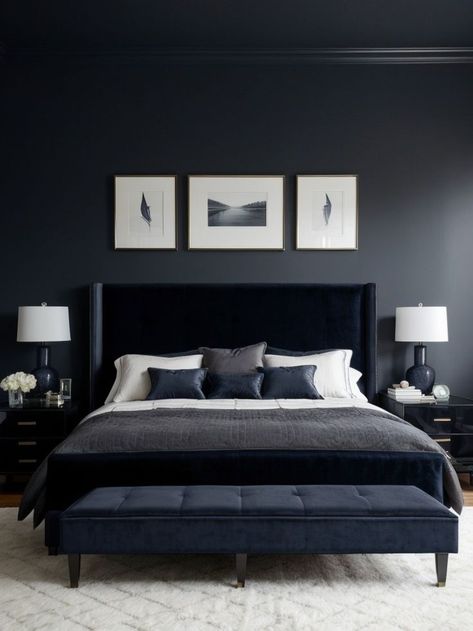 Create a captivating focal point in your bedroom with a dark moody accent wall using rich, deep colors like navy blue or charcoal grey. Complement the wall with modern furniture pieces, such as a sleek platform bed or a velvet-upholstered armchair, to add a touch of elegance and sophistication to the space. Dark Moody Accent Wall, Dark And Cozy Bedroom, Moody Accent Wall, Dark Modern Bedroom, Accent Furniture Bedroom, Dark And Cozy, Navy Blue Bedrooms, Grey Accent Wall, Accent Wall Ideas