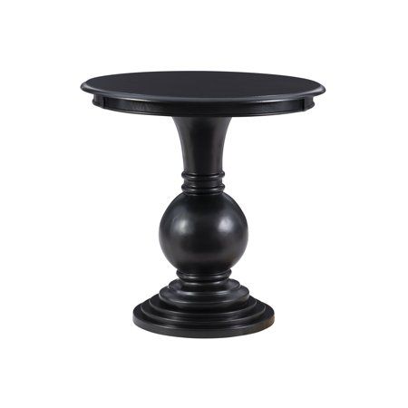 This circular Powell Elissa accent table features a stepped base and turned pedestal that come together to create a timeless and sophisticated piece. Measuring at 26 L X 26 D X 26 H, it is a bit oversized and ideal for placement next to a couch or set of chairs in your living room, as an extra surface in your bathroom or as additional table space wherever you like to entertain. The jet black painted finish pops against a variety of color schemes but can also offer a blending effect when paired w Round Wood Accent Table, Black Accent Table, Powell Furniture, Basement Redo, Large Couch, Round Accent Table, Wood Accent Table, Accent Side Table, Black Side Table