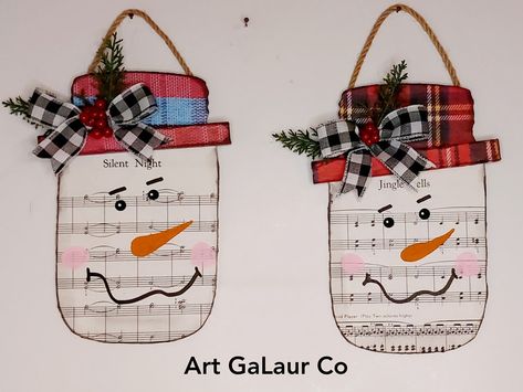 Art GaLaur Co - I used wood mason jar cut outs to make... Christmas Mason Jar Door Hanger, Jar Snowman, Mason Jar Snowman, Mason Jar Door Hanger, Christmas Mason Jars, I Am Loving, Vintage Sheet Music, Adult Crafts, Vintage Sheets