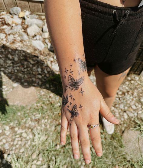 Hand tattoo Wrist Into Hand Tattoo, Butterfly Hand And Wrist Tattoo, Half Butterfly Hand Tattoo, Butterfly Hand And Arm Tattoo For Women, Butterfly And Flowers Hand Tattoo, Hand Poked Butterfly Tattoo, Butterfly Hand Tattoo With Sparkles, Butterfly Hand Tattoo, Butterfly Wrist Tattoo