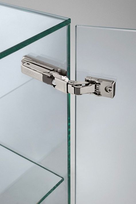 The universal hinge can be used with a very wide range of door materials . Wooden and glass doors and doors made of special and thinner materials, such as metal, ceramics, cements, quartz composites, HPL, HDF and MDF. Glass Door Hinges, Mdf Doors, Architectural Engineering, Glass Hinges, Box Hinges, Glass Shower Doors, Glass Boxes, Storage Design, Glass Shower