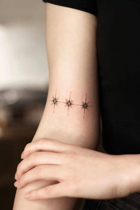 Stars represent hope, dream, and strength. They are the gemstones of the night. Their light reminds us of endless possibilities, something to… 3 Star Tattoo, Dainty Star Tattoo, 3 Stars Tattoo, Mother Of 3 Tattoo Ideas, Star Tattoos Behind Ear, Siblings Tattoo For 3, North Star Tattoo, Star Tattoo On Shoulder, Trap Tattoos Men