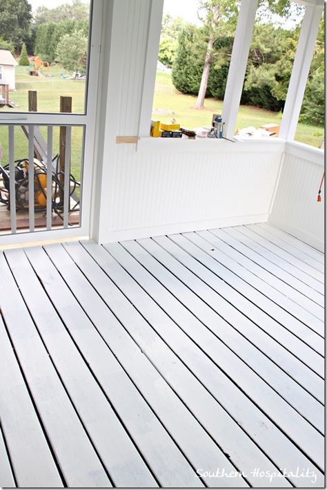 painted white porch floor | white floor Painted Wood Porch Floor, White Porch Floor, Outdoor Vinyl Flooring, Porch Floors, Stenciled Concrete Floor, Painted Deck, Painted Porch Floors, Inexpensive Flooring, Small Sunroom