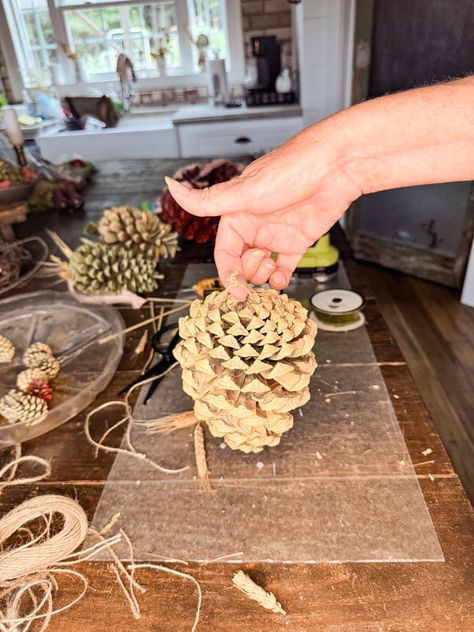 Easy DIY Pinecone Swag For Fall Porch Decor Pinecone Garland Diy How To Make, Pinecone Garland Diy, Diy Vines Decoration, Sugar Pine Cones, Diy Swag, Cones Diy, Vine Decoration, Pinecone Crafts Christmas, Pinecone Garland