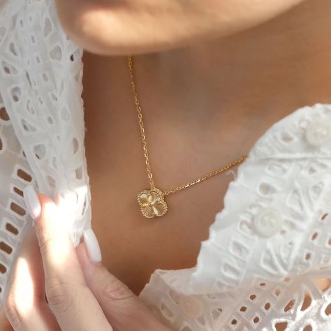 As unique as your fingerprint, as personal as your signature—our golden clover necklace becomes a part of you. It’s not just jewelry; it’s an extension of your identity. Casual luxury at its finest.This piece doesn’t just accessorize—it transforms. From intimate gatherings to grand soirées, our 18k gold plated clover design adapts effortlessly. Its subtle sparkle and intricate detailing speak volumes about your refined taste without saying a word. Explore our collection of fine jewelry and ... Gold Van Cleef Necklace, Van Cliff Jewelry, Van Cleef Necklace, Alhambra Necklace, White Clover, Van Cleef And Arpels Jewelry, Cartier Necklace, Clover Design, Expensive Jewelry Luxury