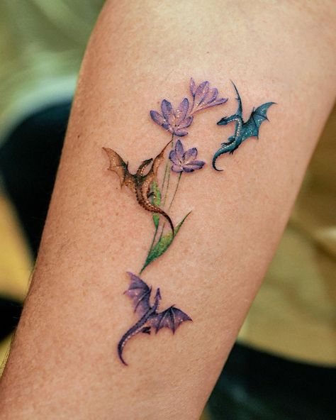 Dragon Tattoo Detailed, Colorful Dragon Tattoo For Women, Tattoos For Queer Women, Mother Son Dragon Tattoos, Owned Tattoos For Women, Sisu Dragon Tattoo, Small Dragon Line Tattoo, Dual Dragon Tattoo, Book With Dragon Tattoo