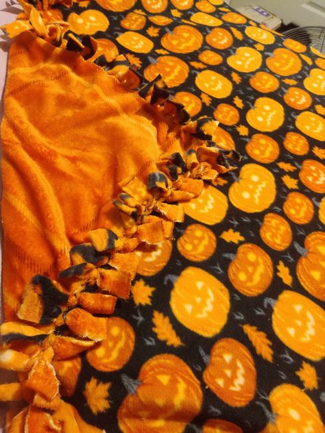 perfect homemade tie blanket for Halloween and fall time. Blanket is 5'x4' Halloween Blanket Making, Tie Blankets Fleece Fall, Halloween Tie Blankets, Diy Halloween Blanket, Fall Tie Blanket, Tie Blanket Ideas, Tie Knot Blanket, Seasonal Room Decor, Fall Sleepover