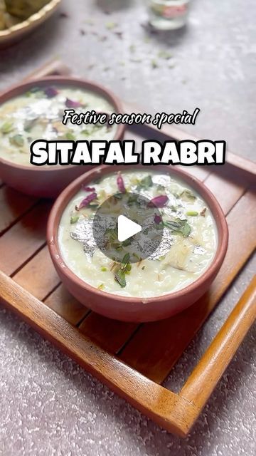 Shyama Thanvi on Instagram: "Indulge in the rich and creamy goodness of homemade Sitafal Rabri, infused with the sweetness of fresh sitafal and delicately garnished with rose petals and dry fruits. A true treat for the senses!

Ingredients:

1/2 litre milk
30 grams grated paneer
1 cup sitafal pulp
4 tbsp sugar (adjust to taste)
1/2 tsp cardamom (elachi) powder
Rose petals, for garnish
Silver leaf (optional), for garnish
Assorted dry fruits, for garnish
Instructions:

In a heavy-bottomed pan, bring the milk to a boil. Reduce the heat and let it simmer, stirring occasionally, until it thickens slightly.
Add Paneer: Once the milk thickens, add the grated paneer and mix well. Cook for another 5-7 minutes.
Stir in the sugar and cardamom powder. Continue to simmer until the sugar dissolves compl Dal Bati Churma Photography, Sambar Powder Recipe, Badam Milk Powder Recipe, Bisibelebath Powder Recipe, Milk Powder Barfi, Cardamom Powder, Dried Fruit, Paneer, Festival Season