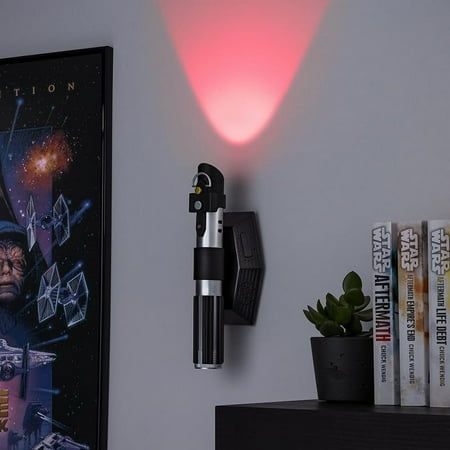 Unleash the power of the Sith within your home decor with the Darth Vader Lightsaber Uplighter. Crafted to resemble the iconic weapon of the galaxy's most fearsome villain, this uplighter is not just a light source, but an emblem of the dark side's might. Star Wars enthusiasts will revel in its authenticity, as it plays official lightsaber sounds when activated, immersing you further into the universe. 10" in length, this light also has a night light mode, which provides a subtle glow, perfect f Star Wars Painted Wall, Darth Vader Bathroom, Star Wars Movie Room, Marvel Bathroom Decor, Teen Star Wars Room, Star Wars Kid Room, Star Wars Accent Wall, Star Wars Rooms, Star Wars Room Boys