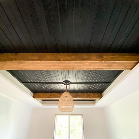 Looking for ideas to turn your tray ceiling into a focal point? By simply adding beams and carsiding, you can change the look of an entire bedroom, family room, kitchen, etc. Check out this post for a full DIY tutorial on how to turn your tray ceiling into a statement. Wood Beam Tray Ceiling, Half Vaulted Ceiling With Beams, Basement Tray Ceiling Ideas, Tiny Home Rustic Interior, Painted Wood Ceiling With Beams, Dining Room Tray Ceiling Ideas, Shiplap Entire Room, Adding Wood To Ceiling, Black Stained Wood Ceiling