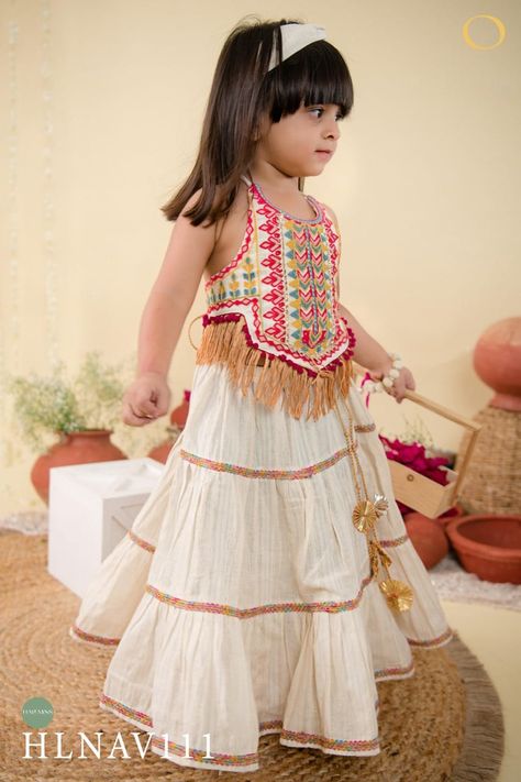 Navratri is a vibrant Hindu festival celebrated over nine nights to honor the divine feminine. Here's a description of a kids' Navratri collection: *Collection Name:* Little Divines *Description:* Get ready to celebrate the vibrant spirit of Navratri with our Little Divines collection! This exquisite range of traditional attire is specially designed for kids to revel in the festive joy. *For Girls:* - Chaniya Cholis in vibrant hues and intricate designs - Adorable Lehengas with matching c... Lehenga Choli For Navratri, Classic Lehenga, Handmade Latkan, Choli For Navratri, Pleated Lehenga, Indian Dresses For Kids, Ready To Wear Lehenga, Halter Neck Blouse, Chaniya Choli Designs