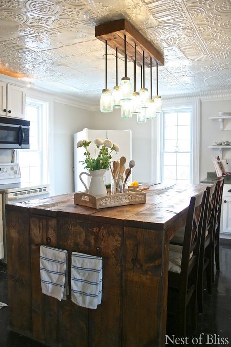 farmhouse kitchen @INDI Interiors - Nest of Bliss Tin Ceiling Kitchen, Kitchen Ceiling Tile, White Tin Ceiling, Kitchen Credenza, Trendy Farmhouse Kitchen, Exterior Light Fixtures, Farmhouse Kitchen Island, Farmhouse Light Fixtures, Kitchen Ceiling