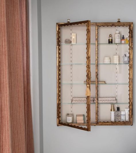 A bathroom completed last year with a huge 20thC Italian gilt metal cupboard from @brownrigguk hanging next to a shower curtain made with… | Instagram Curtain Bathroom Cabinet, Kitchen Curtain Cabinet, How To Hang A Cabinet On A Wall, In Shower Storage Ideas, Shower Curtain Hanging Ideas, Bathroom Shower Storage Ideas, Bath With Shower Curtain, Bathroom Cupboard Ideas, Metal Cupboard