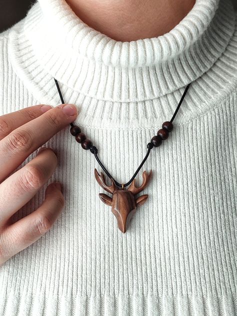 A captivating piece of wearable art that captures the beauty of nature, our Handmade Wooden Pendant Necklace.   Whether it be for a birthday, anniversary, or from a loved one, this exquisite pendant is the ideal gift for anyone who enjoys the enchanting allure of nature and wants to adorn themselves with something unique. 😎 We make just a few of each of our products. So you would have a unique necklace. 🍀🍀This pendant is made from eco-friendly and naturally sourced materials, emphasizing our Boho Wood Jewelry, Wooden Necklace Handmade, Wooden Pendant Necklace, Wooden Deer, Wood Sculpture Art, Deer Necklace, Wood Jewelery, Diy Jewelry Unique, Nature Necklace