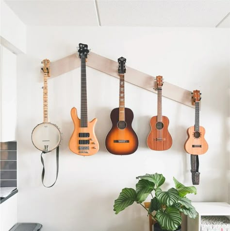 Musical Instruments Wall Decor, Instrument Display Wall, Office With Guitars, Guitar Wall Display Bedroom, Guitar Wall Bedroom, Hanging Instruments On Wall, Guitar Wall Hanger Ideas, Guitars On Wall Living Room, Music Room At Home