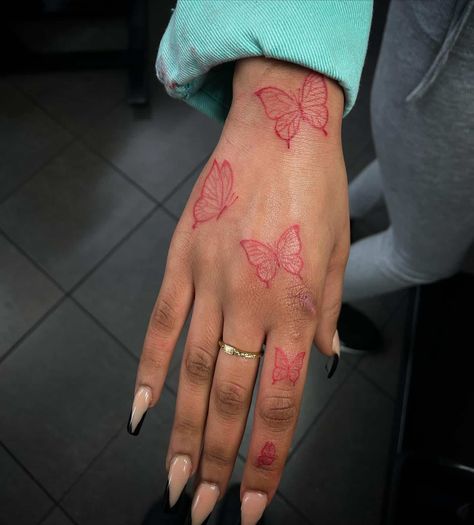 40 Beautiful Red Butterfly Tattoo Ideas for Men & Women in 2023 Butterfly Tattoo Designs On Hand, Red Butterfly Tattoo Finger, Red Ink Butterfly Tattoo Hand, Museum Full Of Art Tattoo, Red Butterfly Hand Tattoo For Women, Small Tattoos For Arm For Women, Red Hand Tattoo Black Women, Red Ink Finger Tattoos For Women, Hand Tattoo Butterflies