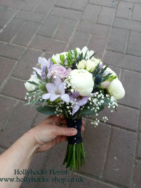 Bridesmaid hand tied wedding in purple, blue and white. Flowers including white Duchess du Nemours Peony, Eryngium thistle and Gypsophila. From £50 Weeding Themes, Thistle Bouquet, Flower Arranging Tutorial, Wedding August, Lavender Wedding Flowers, Newton Abbot, White Weddings, Button Bouquet, Wedding Hands