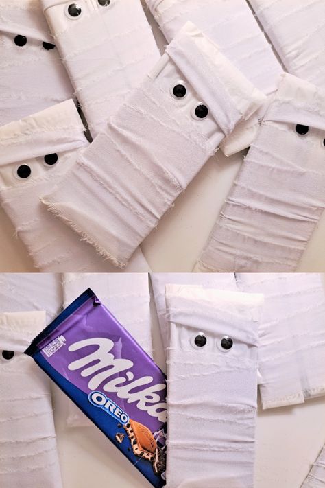 Halloween white Mummy wrapped Chocolate bars for children! These creative candy for kids are an awesome trick or treat candy idea for your party! What you get: Each mummy consists of a Milka chocolate bar wrapped with white ribbons. Wiggly eyes are then added to the outer packaging The chocolate bar is unopened and wrapped while still being in its original packaging. Each Milka chocolate bar weighs 100g #halloween #halloweencandy #mummy #creativecandy #sweetsforkids #kidssnacks #chocolatebars Full Size Candy Bars Halloween Ideas, Halloween Candy Wrapping Ideas, Wrapped Chocolate Bars, Mummy Treats, Halloween Candy Bar, Chocolate Bars Gift, Milka Chocolate, Chocolate Bar Wrapping, Trick Or Treat Candy