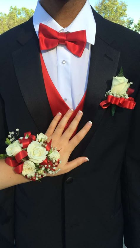 French nails/ black tux/ red vest 15 Chambelanes Suits Red, Red Prom Dress Couple Outfit, Black And Red Hoco Couple Outfits, Red Hoco Ideas, Matching Prom Couples Red, Red And Black Couple Outfits Formal, Corsages For Red Dress, Homecoming Red Dress Couple, Red Prom Couple Outfit Black