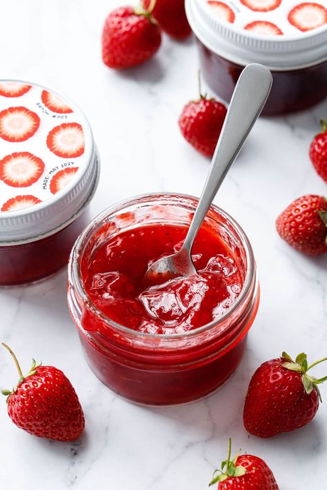 Classic Strawberry Jam in an open glass jar with a spoon to show texture, with more jars of jam and fresh strawberries in the background. Making Strawberry Jam, Low Sugar Jam, Holiday Recipes Thanksgiving, Homemade Strawberry Jam, Condiment Recipes, Strawberry Flavor, Fresh Strawberries, Jams & Jellies, Jam Recipes