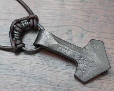 This is a Mjolnir necklace for those of you who prefer a less ornate look, something with unique character that can only be forged with hammer that is not cast in its thousands.  It is an ancient symbol for luck made for those of you who love and honour Thor.  We have forged this Thor's hammer pendant out of pure iron, using traditional tools and methods. The simple design was created by our love of Viking history and our experience as re-enactors. In this Thor's hammer we have combined traditio Blacksmithing Ideas, Mjolnir Pendant, Iron Jewelry, Norse Pagan, Viking Pendant, Thor's Hammer, Electroformed Jewelry, Hand Forged Iron, Forged Iron