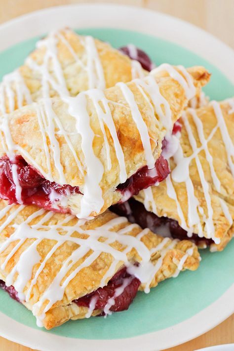 These flaky and sweet cherry turnovers are bursting with fresh cherries and drizzled with a sweet almond glaze. Perfect for breakfast, brunch, or dessert! Cherry Turnover, Cherry Turnovers, Cherry Recipes Dessert, Cherry Hand Pies, Turnover Recipes, Airfryer Recipes, Cherry Desserts, Clam Recipes, Frozen Cherries