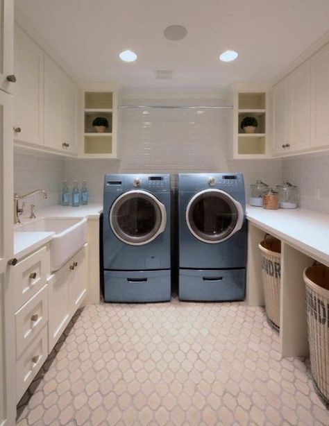 This beautifully put together U-shaped laundry room has ivory cabinets with white quartz countertops and subway tiled backsplash atop an arabesque tile floor. Arabesque Tile Floor, Ivory Cabinets, Vintage Laundry Room Decor, Laundry Room Decorating, Laundry Room/mud Room, Vintage Laundry Room, Basement Laundry Room, Dream Laundry Room, Basement Laundry