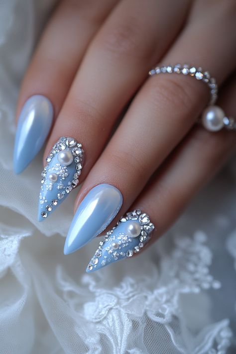 Wedding day manicure. Ice blue polish with mother of pearl accents, teardrop crystal tips.

First impressions last a lifetime - and that’s why every detail matters on your big day, especially when it comes to your nails. Presenting 39 mix of timeless classics and trendy bridal wedding nail art designs that promise to make your ring exchange even more photogenic. Whether you're all about…

Read more: https://tastywed.com/generated-post-39-creative-bridal-wedding-nail-art-designs-and-tips/ Blue And Pearl Nails, Dusty Blue Nails Wedding, Blue Nails With Pearls, Ice Nails Designs, Blue Bridal Nails, Mother Of Pearl Nails, Ice Blue Nails, Wedding Nail Art Designs, Cinderella Nails