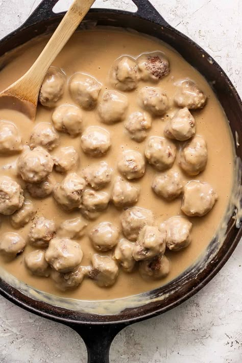 Swedish Meatballs - Our extra saucy Swedish Meatballs recipe is a warm and cozy dinner that you will be making all winter long! #swedishmeatballs #swedishmeatballssauce #swedishmeatballsrecipe #swedishmeatballseasy #swedishmeatballsandnoodles Stovetop Swedish Meatballs, Homemade Swedish Meatball Recipe, Chicken Swedish Meatballs, Authentic Swedish Meatball Recipe, Sweedish Meatball Sauce, Sauce For Swedish Meatballs, Quick Swedish Meatball Recipe, Swedish Meatball Gravy Recipe, Swedish Meatball Bake