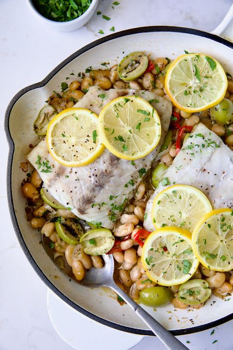 Mediterranean Fish and White Bean Skillet White Bean Skillet, Cannellini Beans Recipes, Frozen Fish Fillets, Mediterranean Fish, Southern Tomato Pie, Poached Fish, Mediterranean Fish Recipe, Night Dinner Recipes, Date Night Dinners