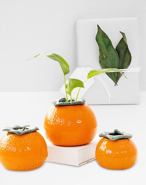 Orange Ceramic Vase, Ceramic Fruit Vase, Orange Flower Vase, Flower Arrangements For Living Room, Orange Home Decor, Unique Home Accent. Material: Ceramic Size:  Small: Lenght 7cm Width 3.3cm Height 8.5cm Weight 230g Medium: Lenght 8.4cm Width 3.6cm Height 10cm Weight 330g Large:  Lenght 9.7cm Width 6.2cm Height 11cm Weight 430g Product Description: The Orange Ceramic Vase is a beautiful and versatile decorative piece for any space. Made from high-quality ceramic materials, this vase features a Orange Home Accessories, Orange Kitchen Accessories, Citrus Centerpiece, Vase Flower Arrangements, Orange Centerpieces, Vase Orange, Orange Home, Orange Ceramic, Ceramic Fruit